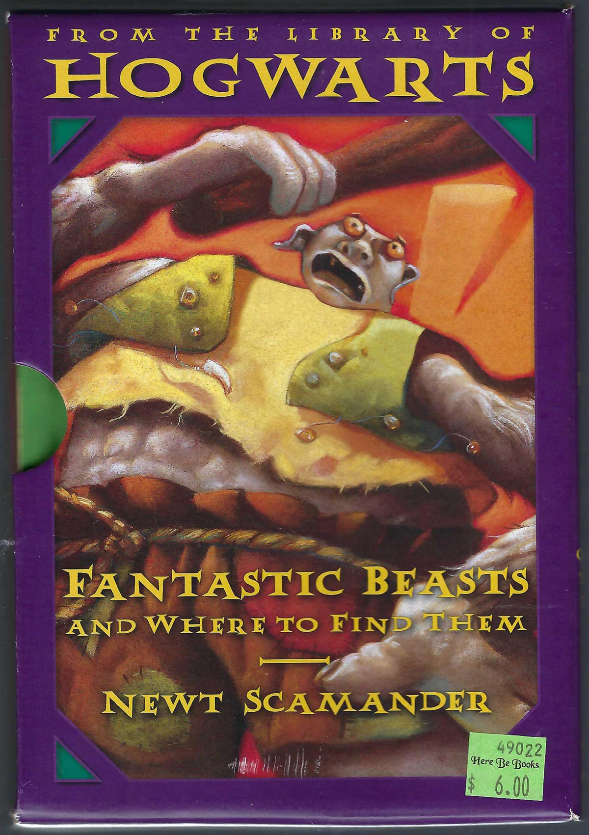 From the Library of Hogwarts boxed set by J. K Rowling with an image of a fantastic creature holding a club.
