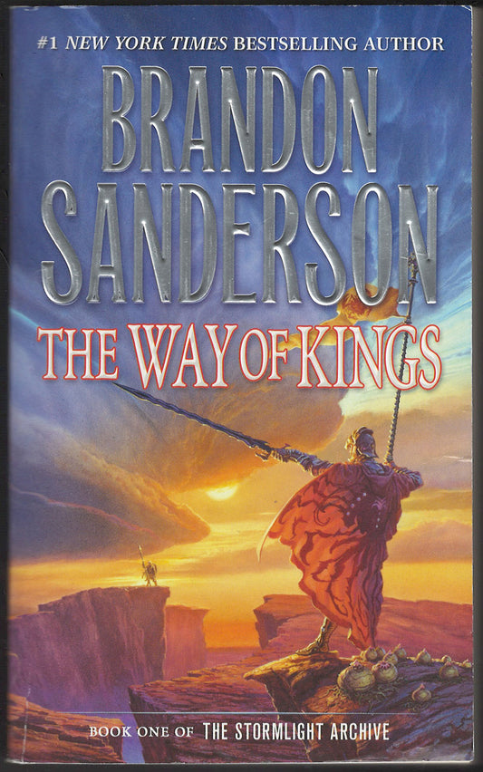 Front cover of The Way of Kings by Brandon Sanderson with a warrior on a cliff at sunset.