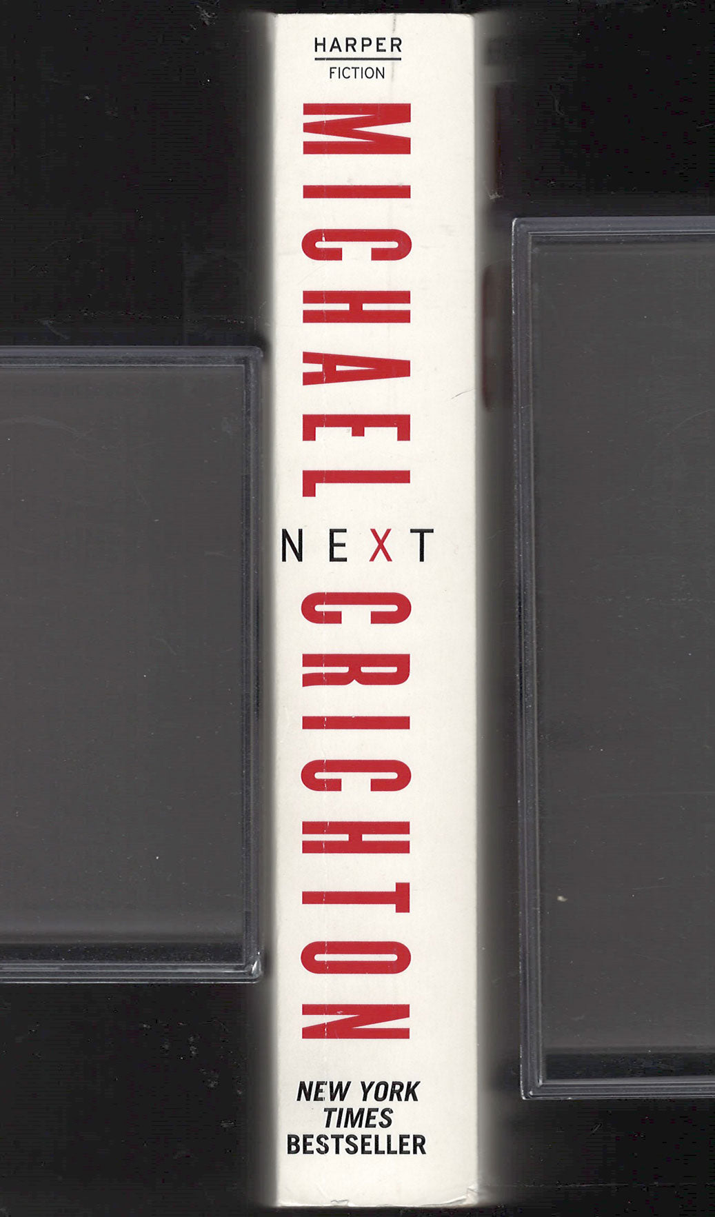 Next by Michael Crichton spine