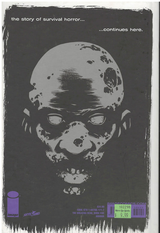 Back cover of The Walking Dead: Book 5 by Robert Kirkman with a zombie face design on a dark background.