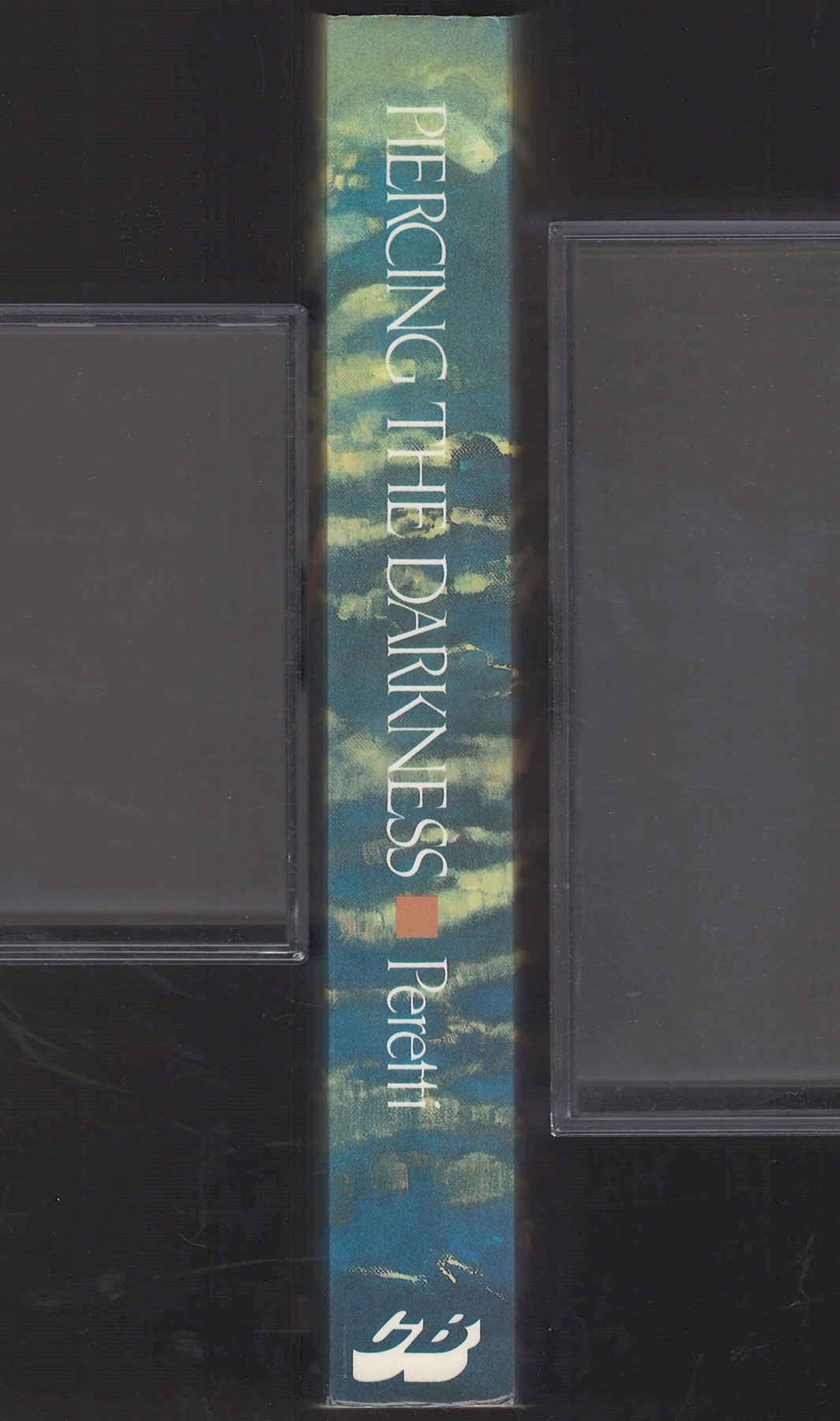 Piercing the Darkness by Frank Peretti spine