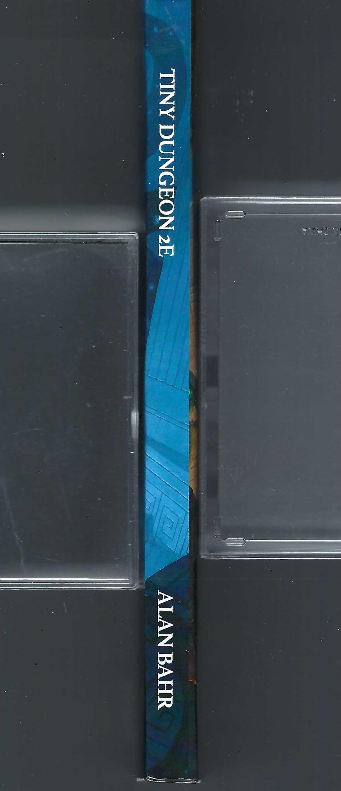 'Tiny Dungeon' by Alan Bahar with a blue spine