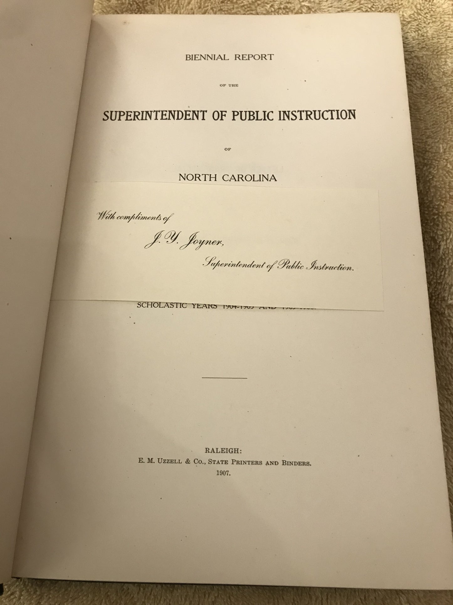 Title page with laid in dedication