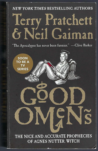 Front cover of Good Omens by Terry Pratchett and Neil Gaiman with a black background and gold text.