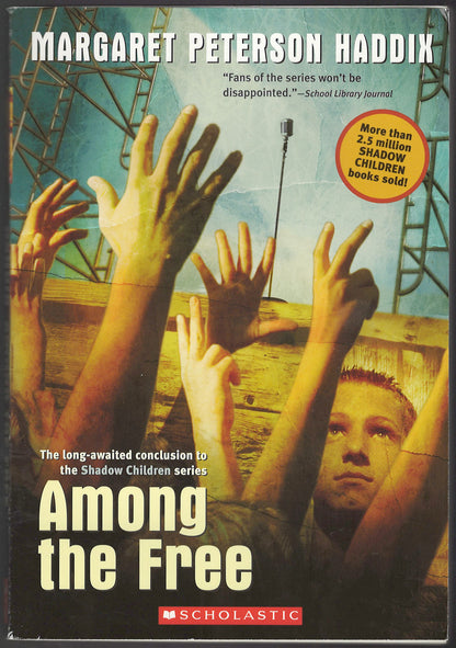 Front cover of Among the Free by Margaret Peterson Haddix, showing hands raised and a child's face.