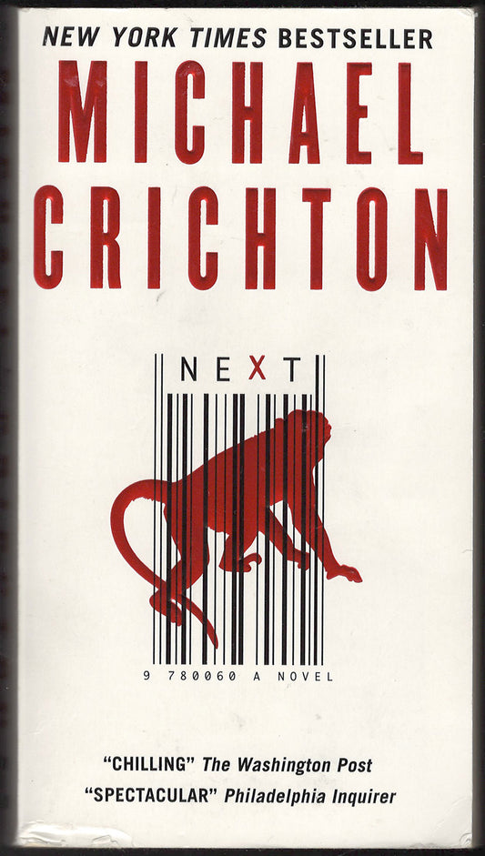 Front cover of Next by Michael Crichton with a barcode and monkey illustration.