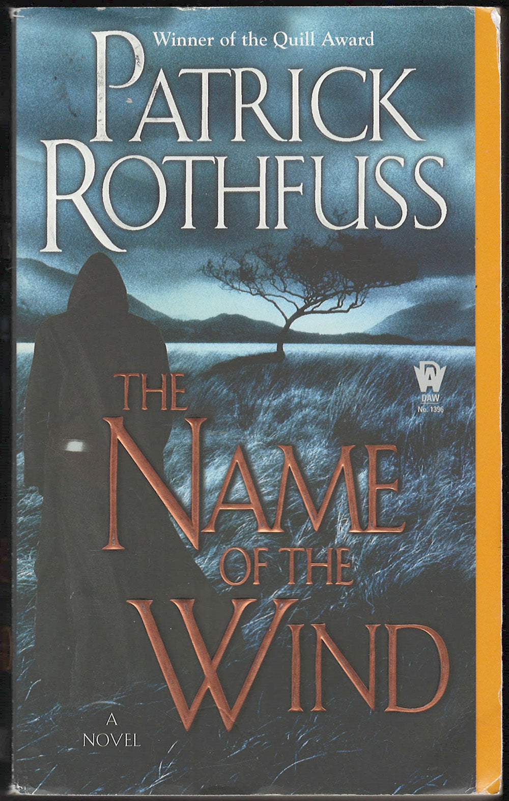 Front cover of The Name of the Wind by Patrick Rothfuss with a hooded figure and the silhouette of a tree.