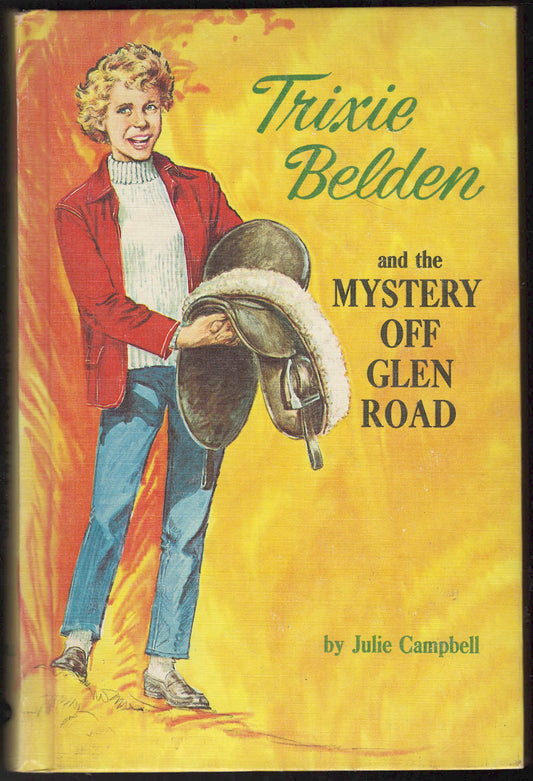 Front cover of Trixie Belden and the Mystery Off Glen Road with Trixie holding a saddle.