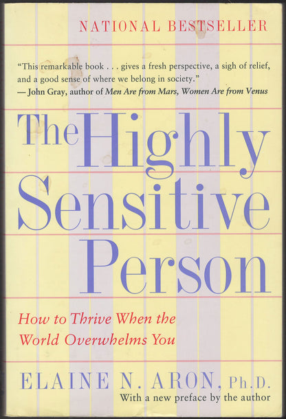 Front cover of The Highly Sensitive Person by Elaine N. Aron with a yellow and purple striped background.