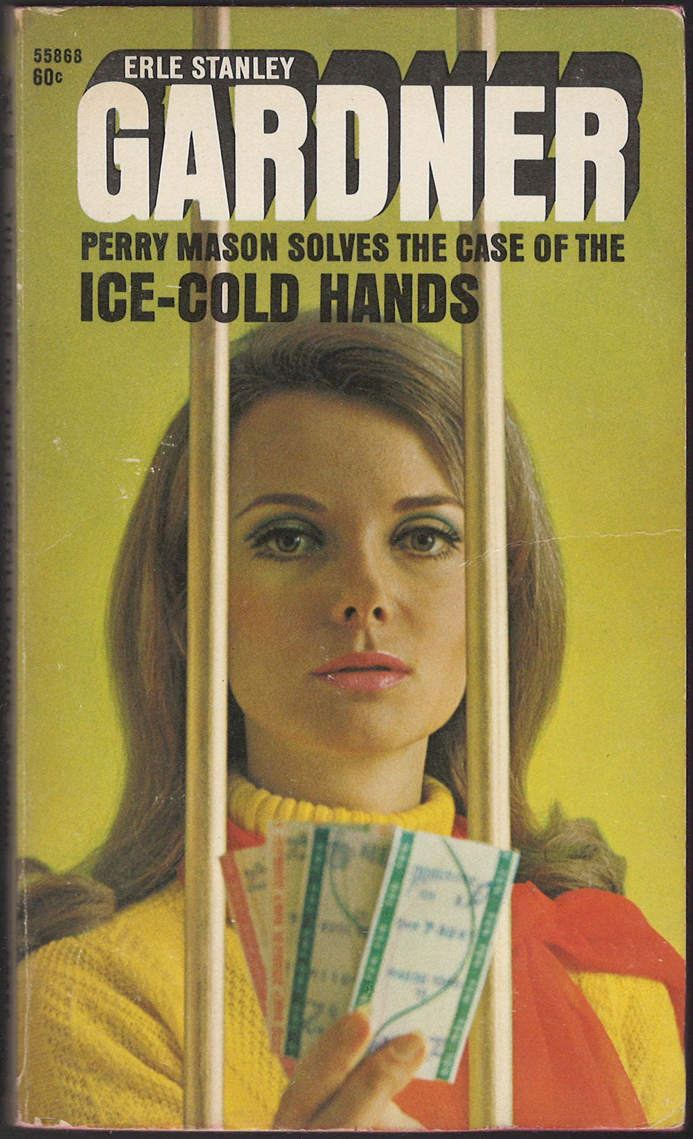 Front cover of The Case of the Ice-Cold Hands by Erle Stanley Gardner featuring a woman holding tickets behind bars.