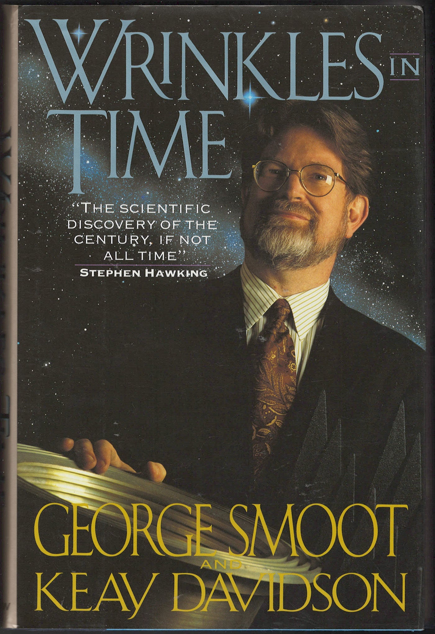 Front cover of Wrinkles in Time by George Smoot and Keay Davidson, featuring a portrait of George Smoot against a dark starry background with blue title text.