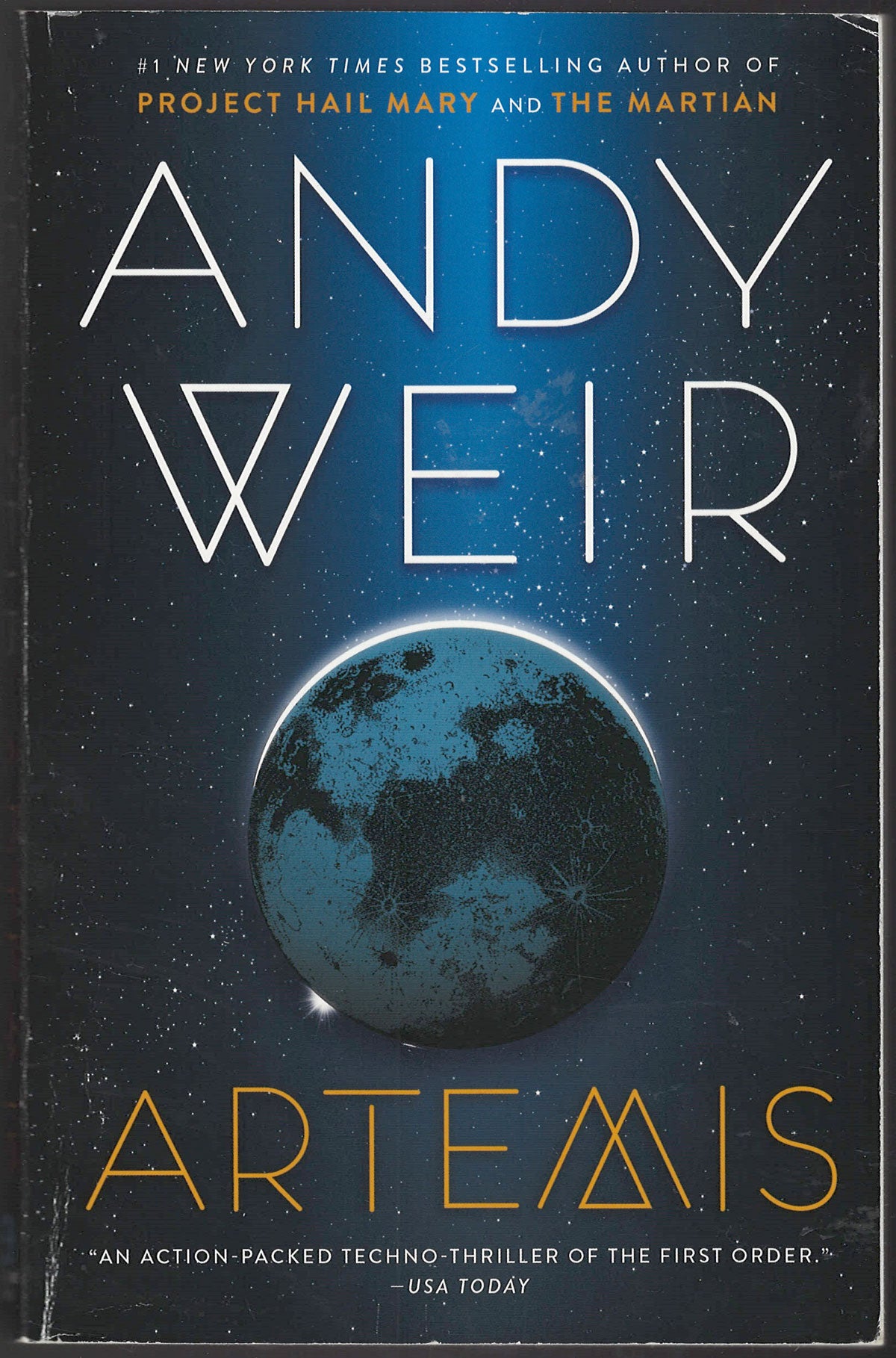 Front cover of Artemis by Andy Weir featuring a planet in space.