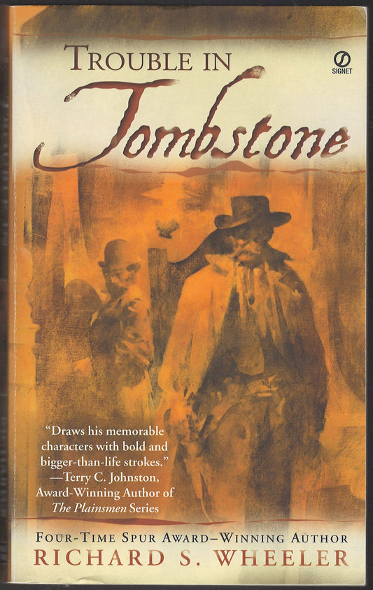 Front cover of Trouble in Tombstone with two men in cowboy attire on a sepia background.