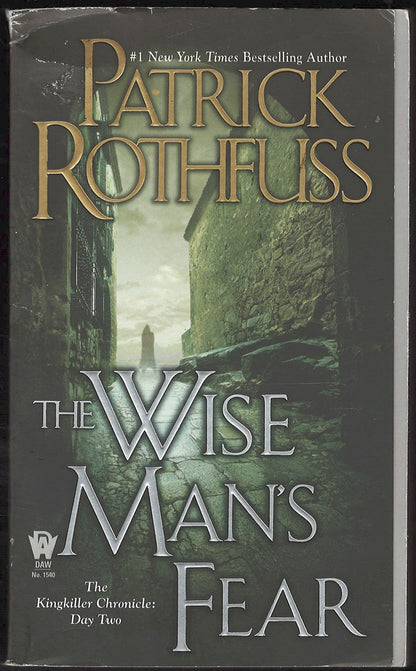 Front cover of The Wise Man's Fear by Patrick Rothfuss with a dark, eerie alleyway image.