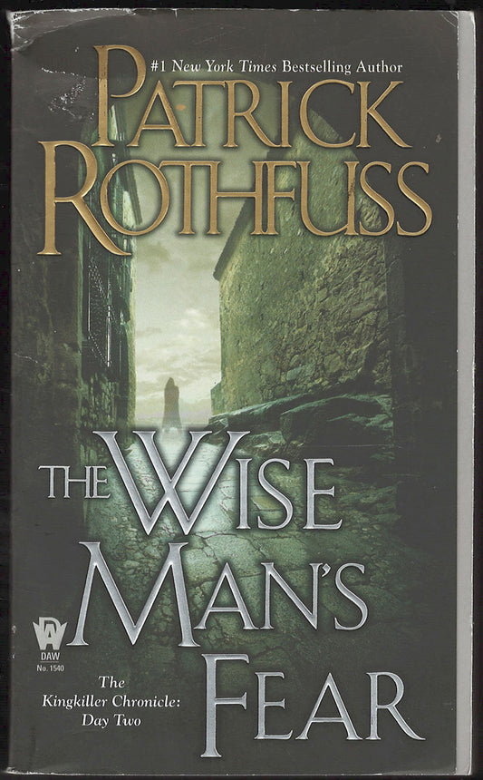 Front cover of The Wise Man's Fear by Patrick Rothfuss with a dark, eerie alleyway image.
