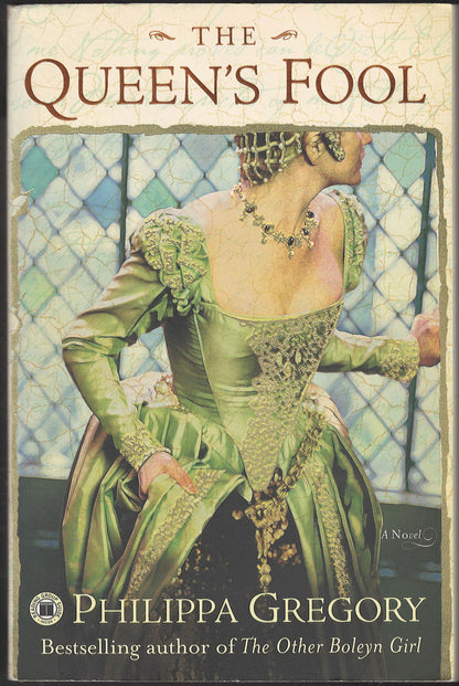 Front cover of The Queen's Fool by Philippa Gregory featuring a woman in a green dress.