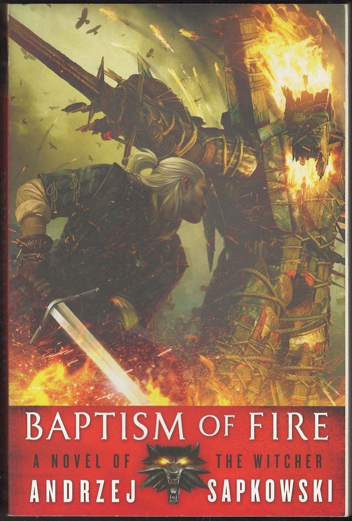 Front cover of Baptism of Fire by Andrzej Sapkowski featuring a warrior with a sword.