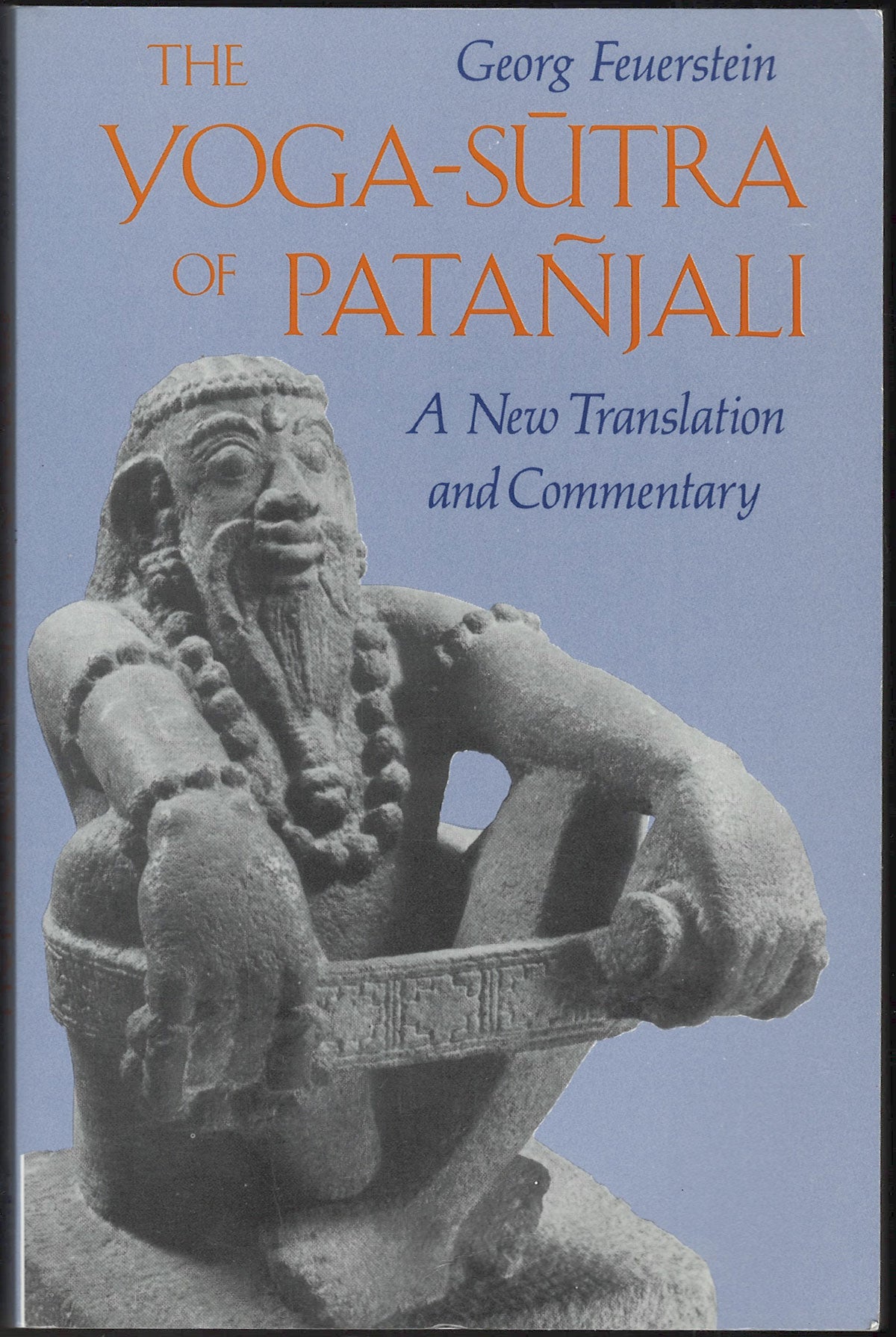 Front cover of The Yoga-Sutra of Patanjali with a statue on a blue background
