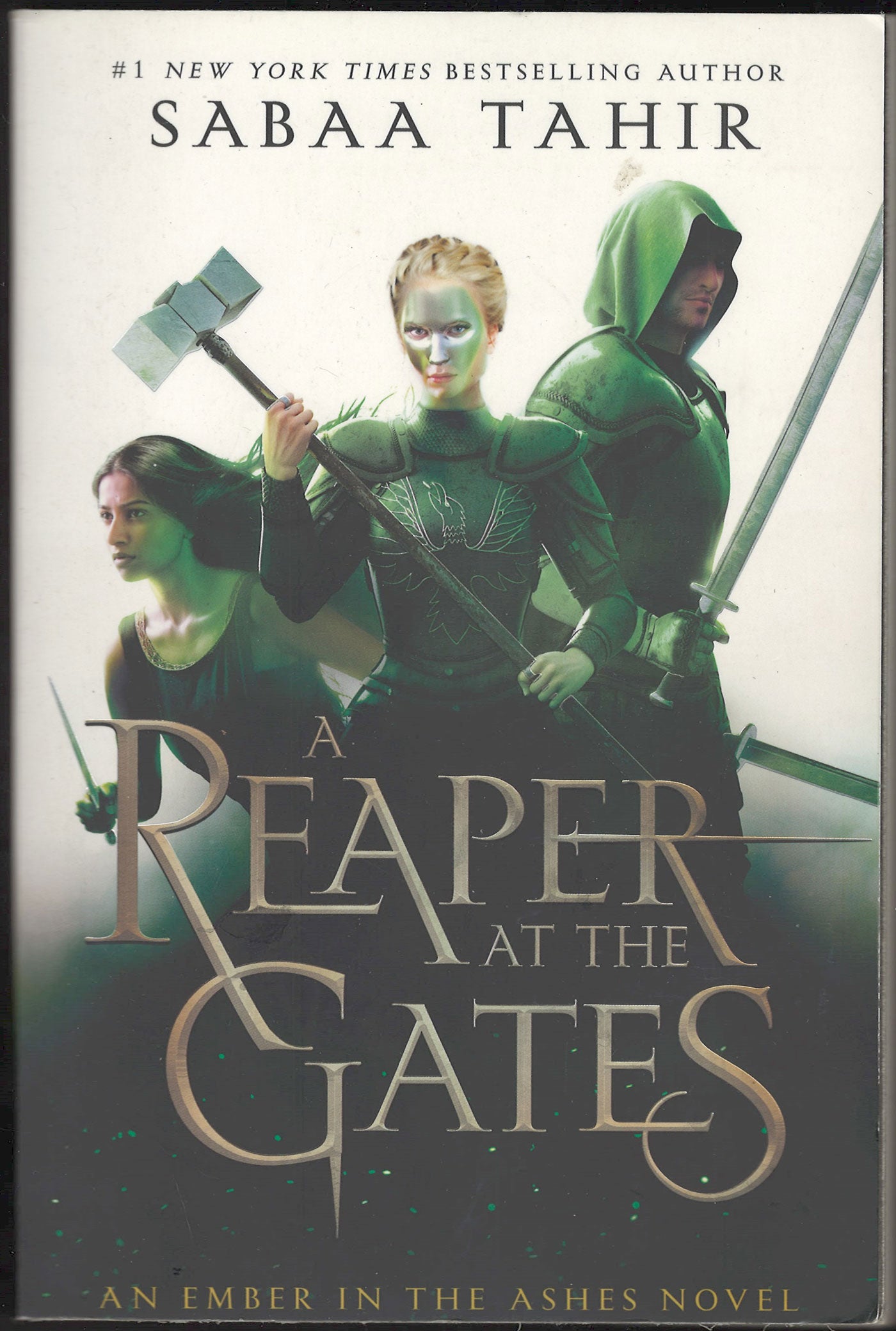 Front cover of A Reaper at the Gates by Sabaa Tahir featuring characters in green with weapons.