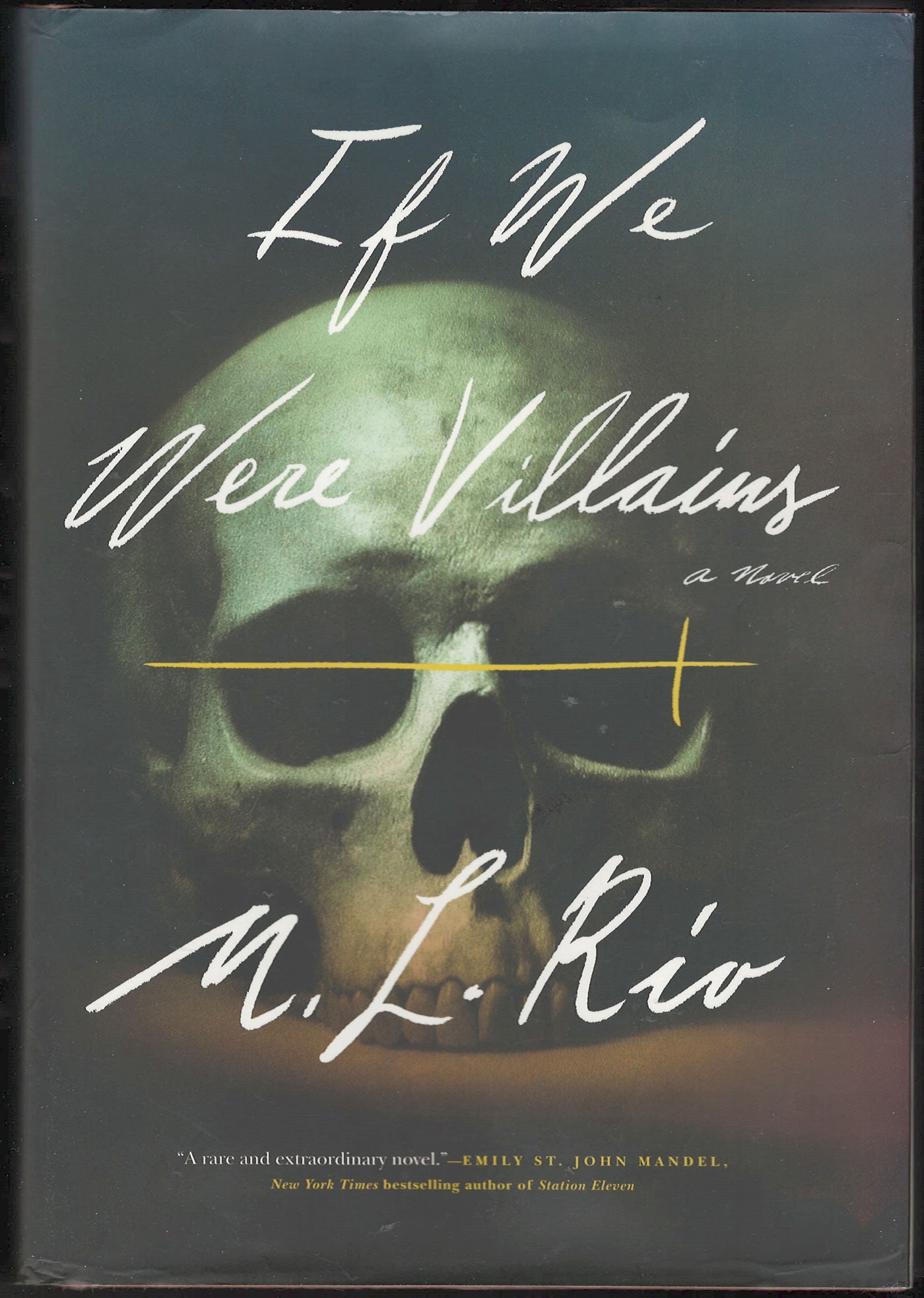 Front cover of If We Were Villains by M. L. Rio with a human skull on a dark background.