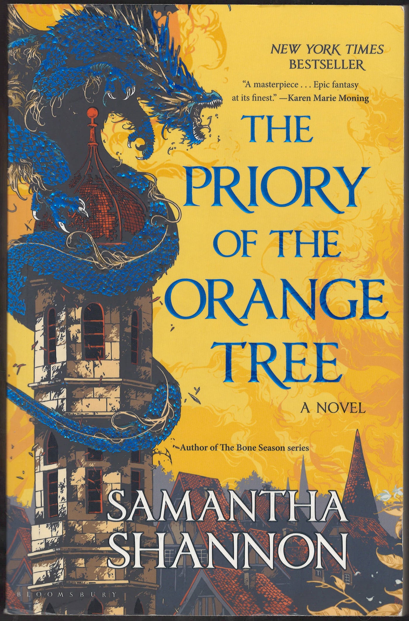 Front cover of The Priory of the Orange Tree by Samantha Shannon with a dragon and tower.