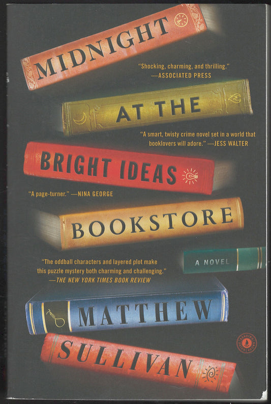 Front cover of Midnight at the Bright Ideas Bookstore by Matthew Sullivan with stack of books.