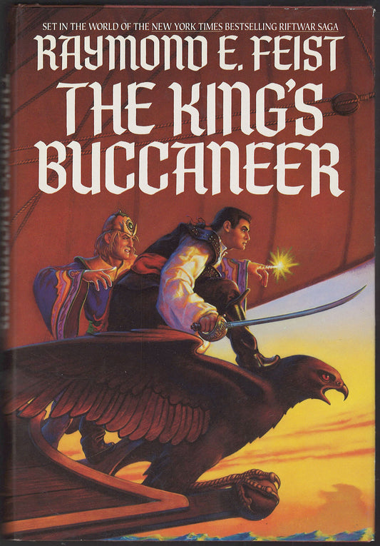 Front cover of The King's Buccaneer by Raymond E. Feist featuring a warrior and a wizard on a ship's figurehead.
