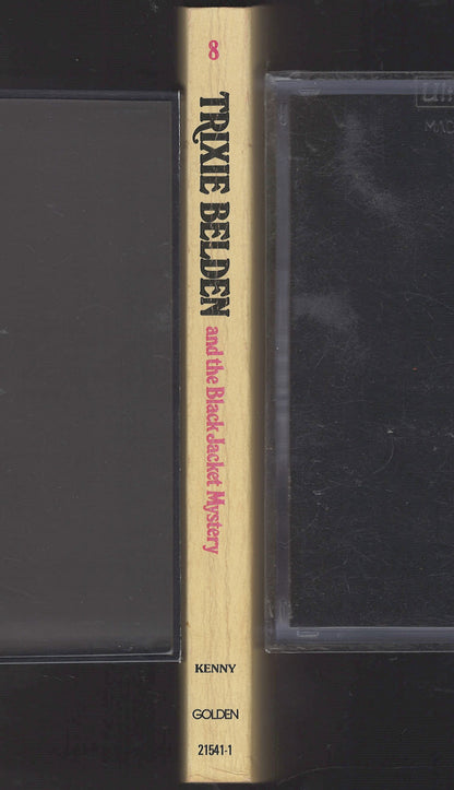 Book titled 'Trixie Belden and the Black Jacket Mystery' by Kenny, published by Golden Books.