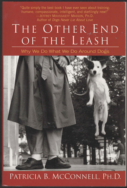 Front cover of The Other End of the Leash with a person and dog on a leash.