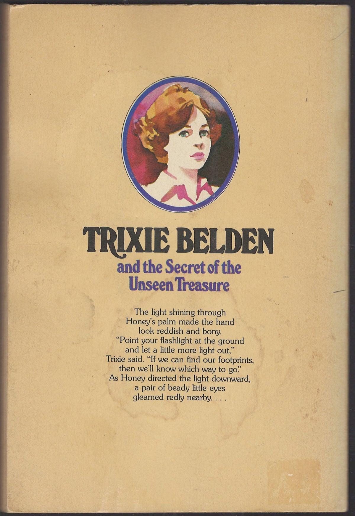 Back cover of Trixie Belden and the Secret of the Unseen Treasure with a portrait of Trixie.