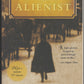 Front cover of The Alienist by Caleb Carr with a silhouette of a person walking away from a horse-drawn carriage.