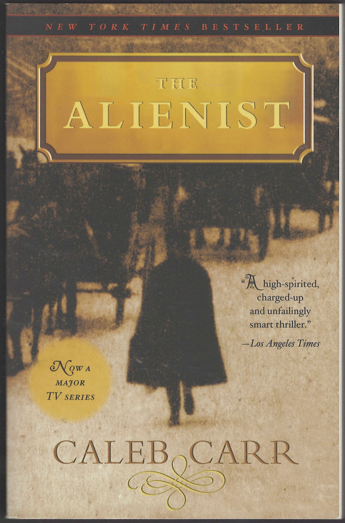 Front cover of The Alienist by Caleb Carr with a silhouette of a person walking away from a horse-drawn carriage.