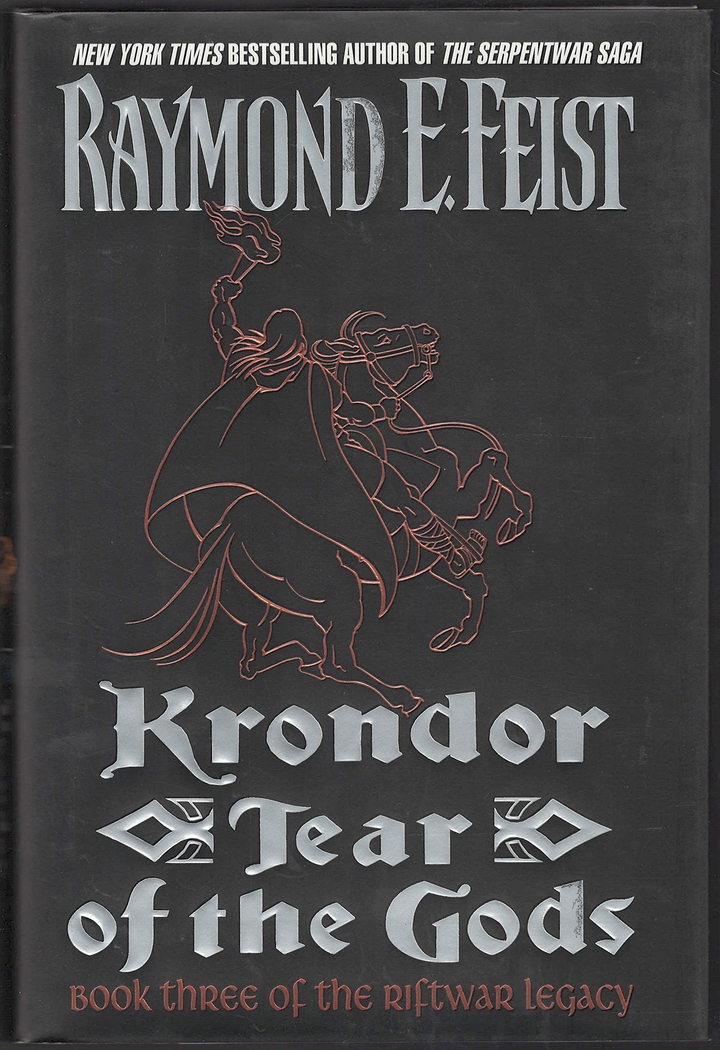 Front cover of Korndor Tear of the Gods by Raymond E. Feist with a  line drawing of a man on a rearing horse.
