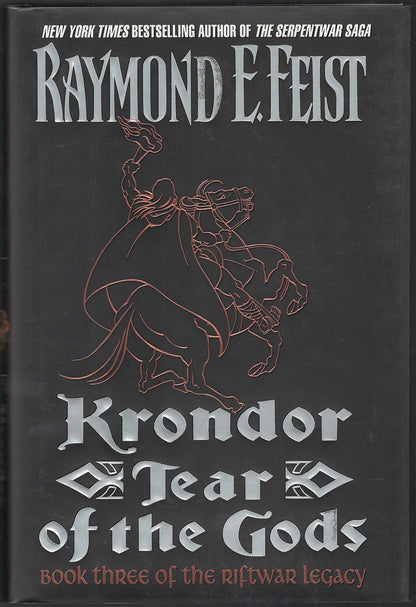 Front cover of Korndor Tear of the Gods by Raymond E. Feist with a  line drawing of a man on a rearing horse.