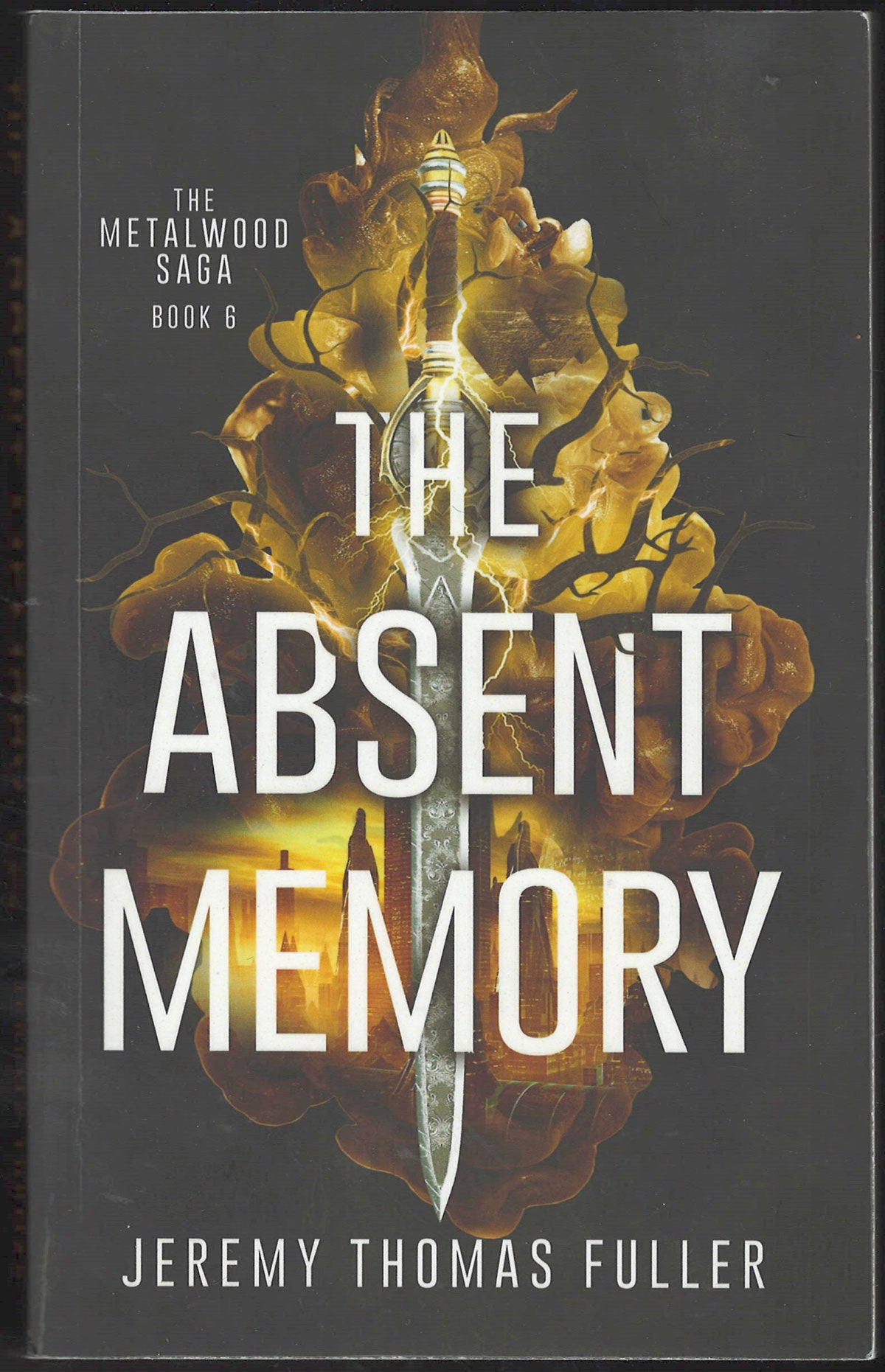 Front cover of The Absent Memory by Jeremy Thomas Fuller, showing a dark gray background with a glowing sword in front of a glowing golden tree, and large white title text.