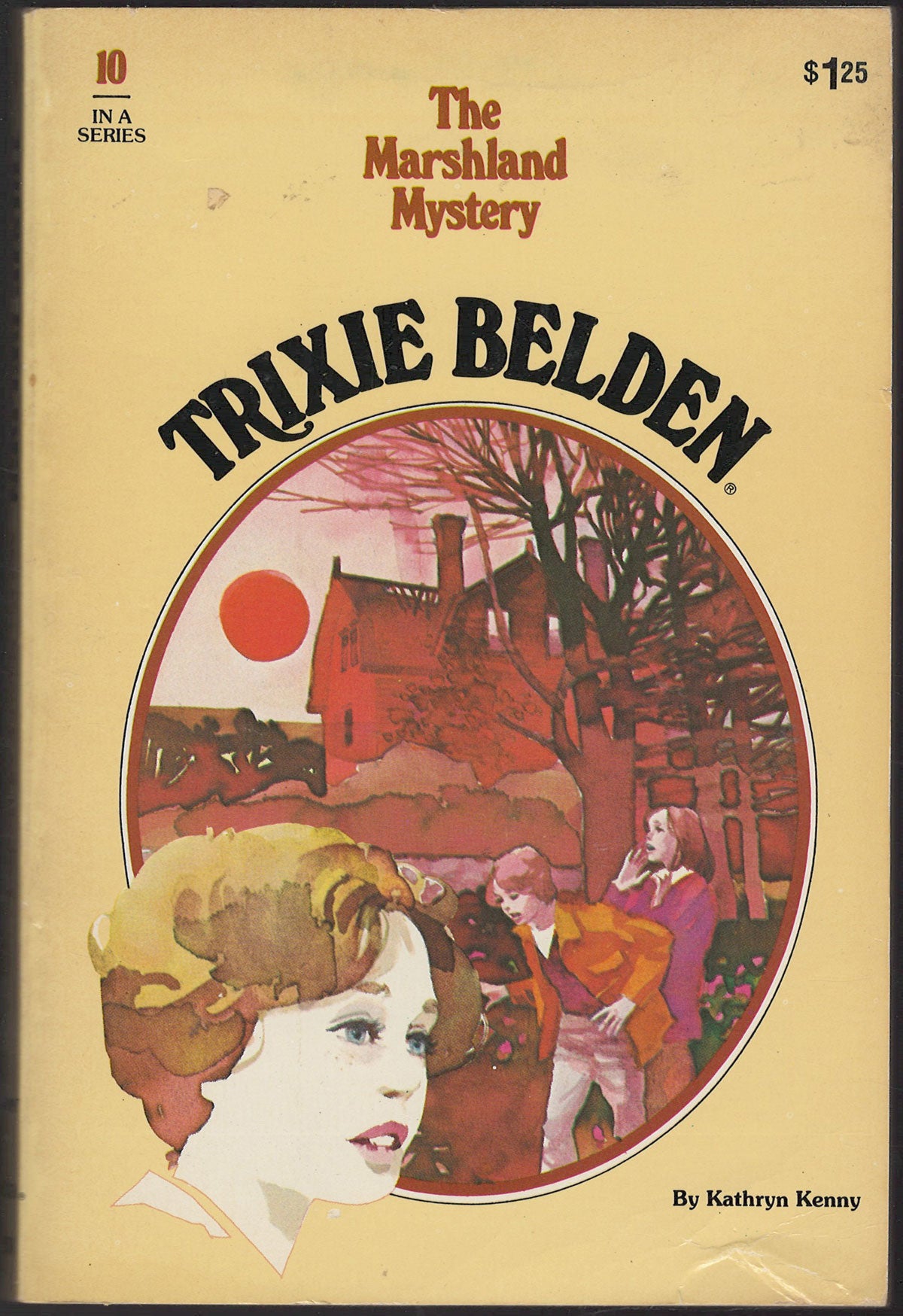 Front cover of Trixie Belden #10 The Marshland Mystery with an image of young girls in front of a house at sunset.