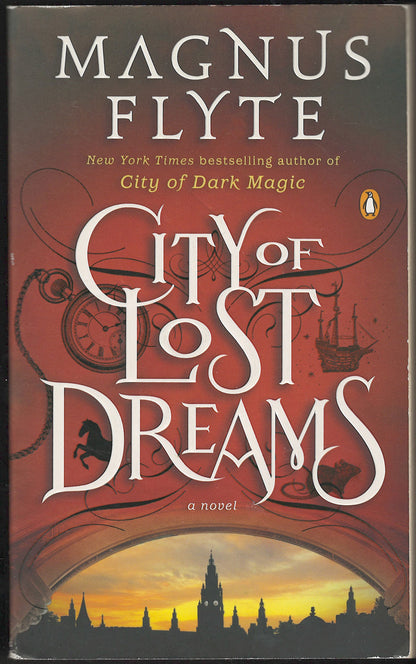 Front cover of City of Lost Dreams by Magnus Flyte with a silhouette of a city.