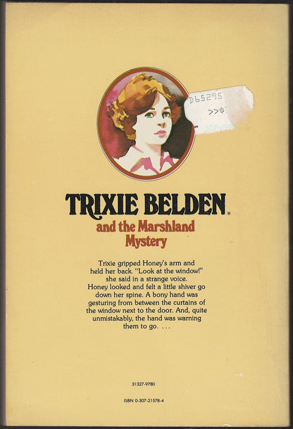 Back cover of Trixie Belden and the Marshland Mystery with a portrait of Trixie