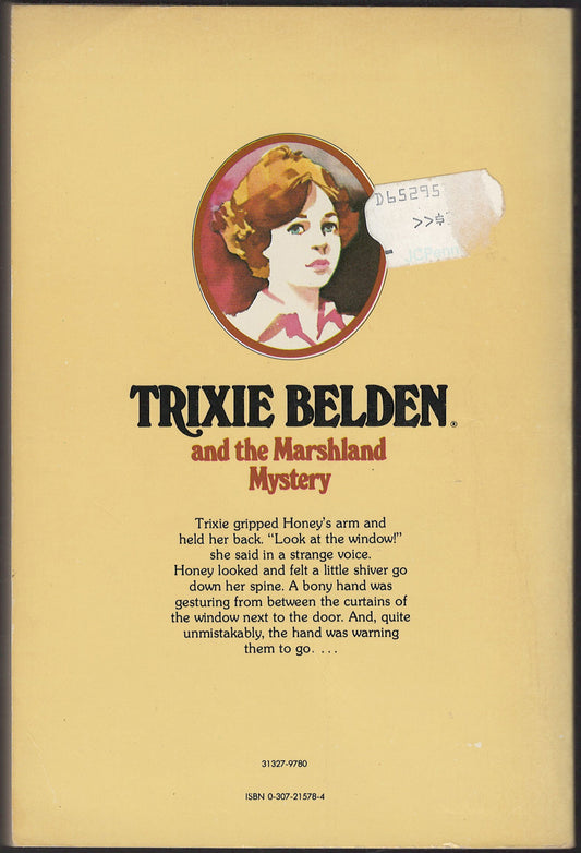 Back cover of Trixie Belden and the Marshland Mystery with a portrait of Trixie