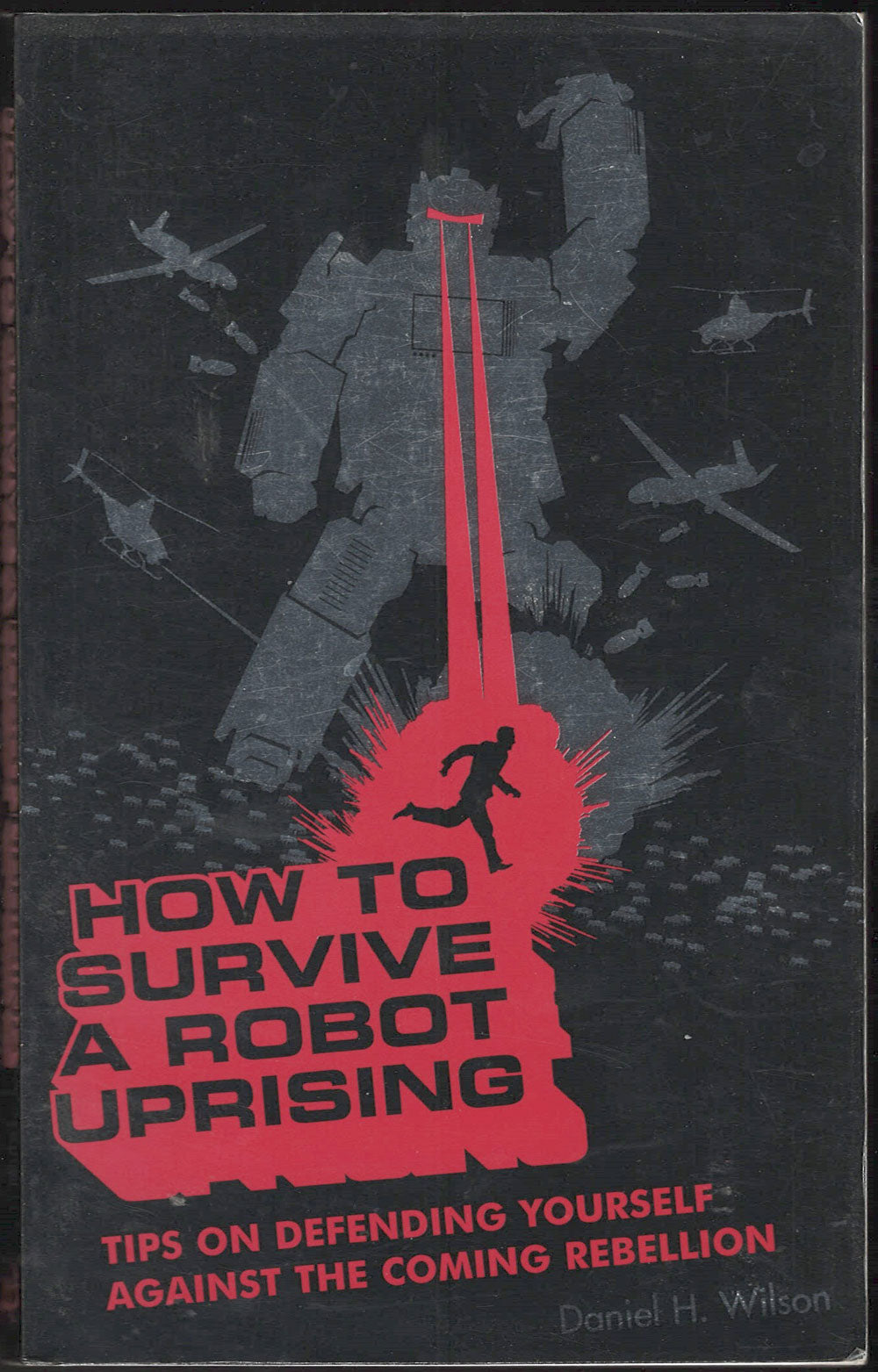 Front cover of How to Survive a Robot Uprising with a silhouette of a person and robot on a dark background.