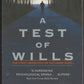 Front cover of A Test of Wills by Charles Todd with a silhouette of a person walking down a path.