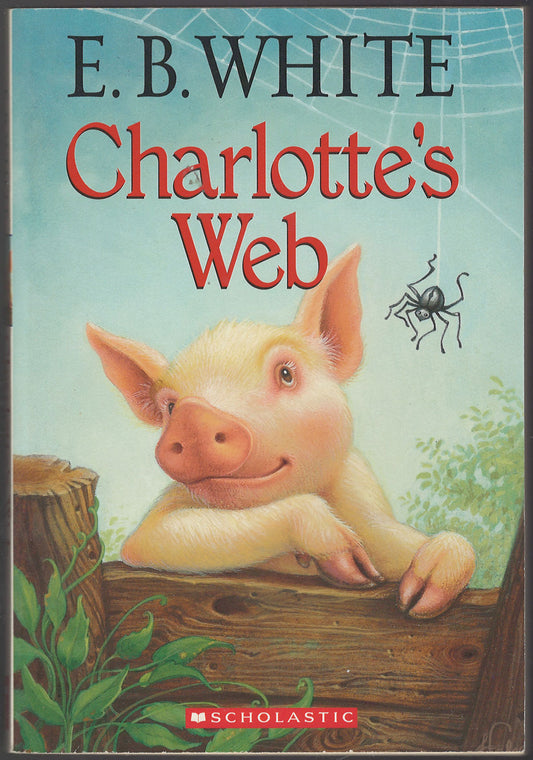 Front cover of Charlotte's Web by E.B. White featuring a pig and spider illustration.