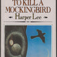 Book cover of 'To Kill a Mockingbird' by Harper Lee with a tree and bird illustration.
