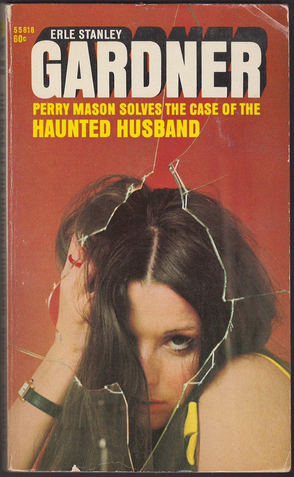 Front cover of The Case of the Haunted Husband by Erle Stanley Gardner with a woman's face seen through broken glass.