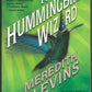 Book cover of 'The Hummingbird Wizard' by Meredith Blevins with a green background and hummingbird illustration.