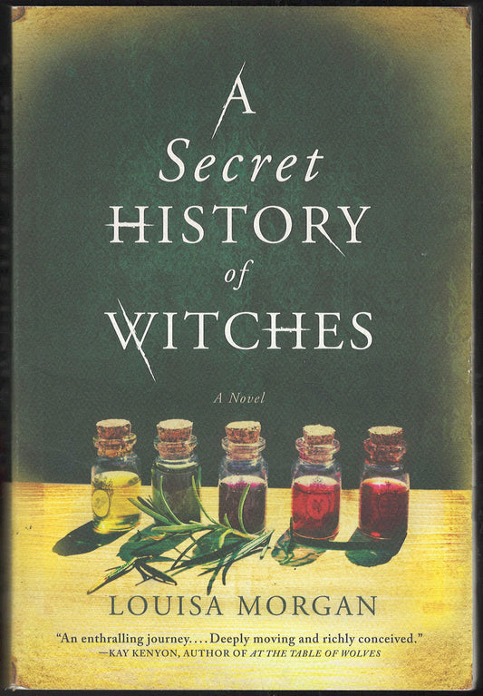 Front cover of A Secret History of Witches by Louisa Morgan with bottles and herbs on a table.