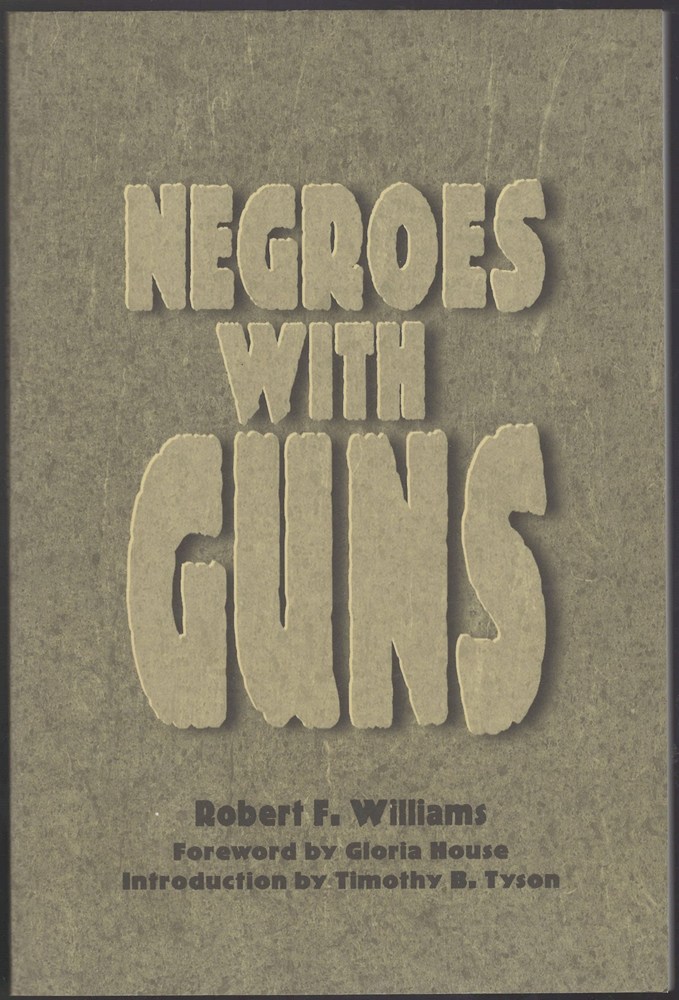 Front cover of Negroes with Guns by Robert F. Williams on a brown background