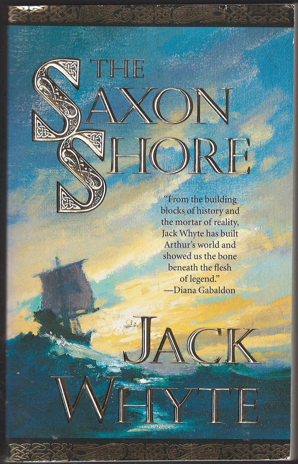 Front cover of The Saxon Shore by Jack Whyte with a ship on water and blue sky.