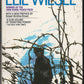 Front cover of Night by Elie Wiesel with an illustration of barbed wire and a silhouette design.