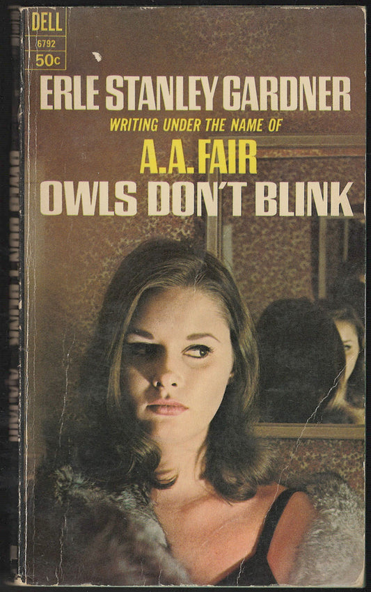 Front cover of Owls Don't Blink by A.A. Fair featuring a woman in front of a mirror.